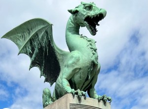 One of the four large dragons on the Art Nouveau Dragon Bridge in Ljubljana.